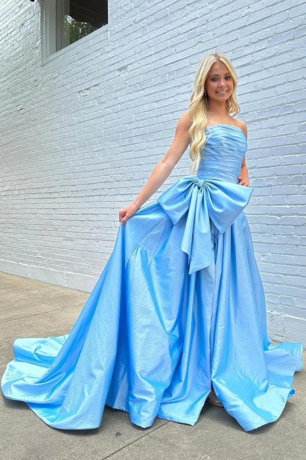 Light Blue Satin Prom Dress with Dramatic Bow and Flowy Skirt - Image 2