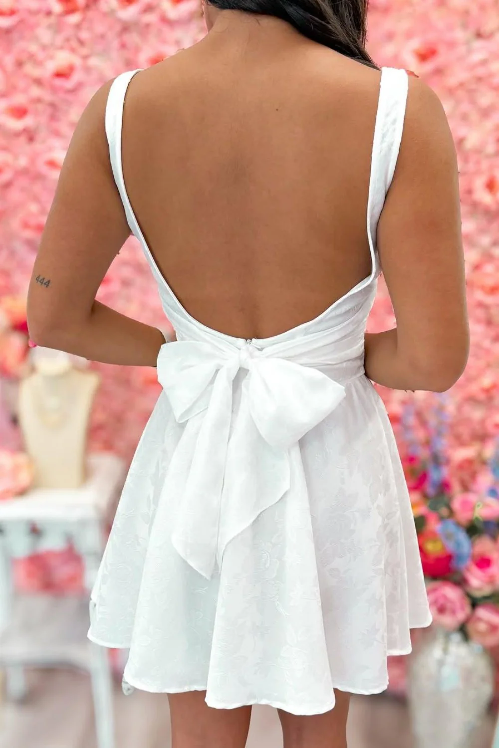 White Open Back Mini Homecoming Dress with Bow Detail and Flared Skirt - Image 6